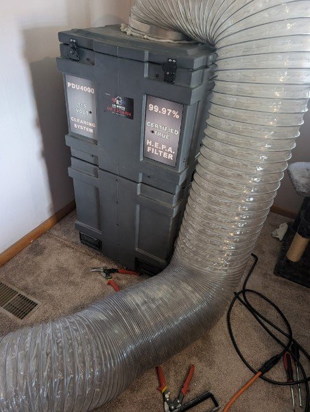 Portable HEPA air cleaning equipment connected to ducting